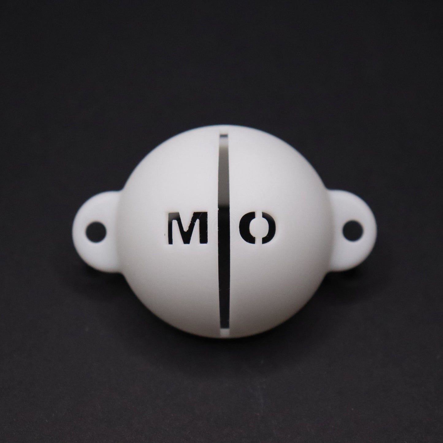 Golf ball marker stencil manufactured via 3D printing in white plastic material. Two letters for initials, one on each side of an alignment line for putting