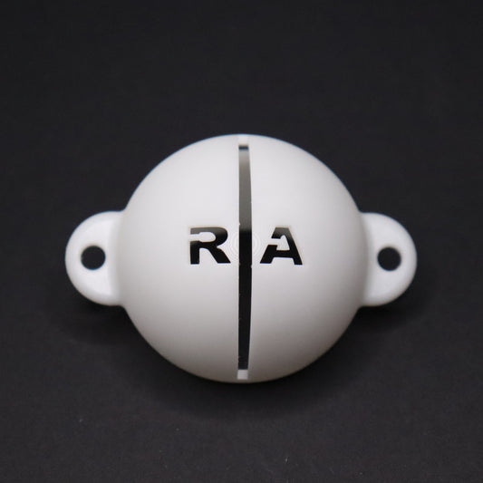 Golf ball marker stencil manufactured via 3D printing in white plastic material. Two letters for initials, one on each side of an alignment line for putting